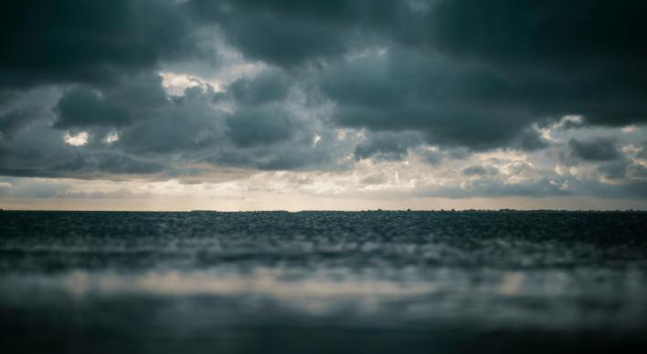Dark storm clouds over dark ocean