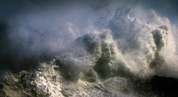 Close up shot of crashing waves and white water.